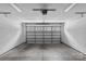 Garage with concrete floor, finished white walls and a windowed garage door at 2906 Hillside Springs Dr, Charlotte, NC 28209