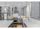 Bright kitchen featuring gray cabinetry, stainless steel appliances, and a large farmhouse sink beneath a window at 2906 Hillside Springs Dr, Charlotte, NC 28209