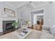 Cozy living room features a fireplace and an open view of the kitchen at 2906 Hillside Springs Dr, Charlotte, NC 28209