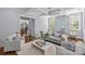 Bright and airy living room with coffered ceiling, comfortable seating, and views of the staircase and front yard at 2906 Hillside Springs Dr, Charlotte, NC 28209
