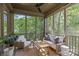 Inviting screened porch with comfortable seating, perfect for relaxation and enjoying the outdoors at 2906 Hillside Springs Dr, Charlotte, NC 28209