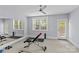 Large workout room with mirror wall, exercise equipment, and a ceiling fan for comfort at 2906 Hillside Springs Dr, Charlotte, NC 28209