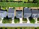 Aerial view of a home with a well-manicured lawn and mature trees at 3664 Privette Rd, Matthews, NC 28104