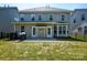 View of a large backyard and patio with double doors leading into the house at 3664 Privette Rd, Matthews, NC 28104