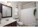 Charming bathroom featuring vanity with sink, toilet, and a shower with curtain at 3664 Privette Rd, Matthews, NC 28104