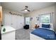 Bright bedroom with dinosaur theme, ceiling fan, and white furniture at 3664 Privette Rd, Matthews, NC 28104
