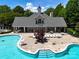 Full view of the neighborhood pool with a sundeck, landscaping, and sun loungers at 3664 Privette Rd, Matthews, NC 28104