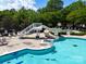 Full view of the neighborhood pool featuring a slide, lounge chairs, and sun deck at 3664 Privette Rd, Matthews, NC 28104