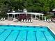Overhead view of the community pool with a pergola, seating, and sparkling water at 3664 Privette Rd, Matthews, NC 28104