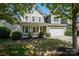 Charming two-story home featuring a well-maintained lawn, a covered front porch, and an attached two-car garage at 3664 Privette Rd, Matthews, NC 28104