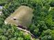 Aerial view of exterior horse farm, surrounded by lush trees at 3664 Privette Rd, Matthews, NC 28104