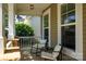 Inviting front porch with seating, perfect for enjoying the outdoors in a cozy and comfortable setting at 3664 Privette Rd, Matthews, NC 28104