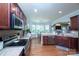 Spacious kitchen with granite countertops, stainless steel appliances, and ample cabinet space for storage at 3664 Privette Rd, Matthews, NC 28104