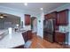 Modern kitchen featuring stainless steel appliances, granite countertops, and stylish cabinetry with hardwood flooring at 3664 Privette Rd, Matthews, NC 28104