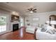 Comfortable living room with a fireplace, TV, and a large sectional sofa, ideal for relaxation and entertainment at 3664 Privette Rd, Matthews, NC 28104