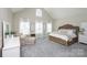 Spacious main bedroom with high ceilings, soft carpet, and large windows, creating a bright and airy ambiance at 3664 Privette Rd, Matthews, NC 28104