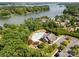 Aerial shot of the community clubhouse, pool and lake views in the distance surrounded by mature trees at 3817 Arial Ln # 145, York, SC 29745