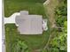 Backyard view of home featuring a deck with lounge area and stone patio with firepit surrounded by lush greenery at 3817 Arial Ln # 145, York, SC 29745