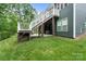 Exterior view of home showcasing the deck, patio with hot tub, and lush backyard, ideal for relaxation at 3817 Arial Ln # 145, York, SC 29745