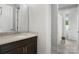 Bathroom featuring granite countertops, dark wood cabinets, and a shower with glass doors at 3817 Arial Ln # 145, York, SC 29745