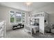 Bright bedroom featuring a lofted bed with a window view, a desk, and carpeted flooring at 3817 Arial Ln # 145, York, SC 29745