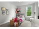 Cozy bedroom with a window, soft carpet, and creative storage for plush toys at 3817 Arial Ln # 145, York, SC 29745