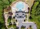 Aerial view of a community pool and clubhouse with seating, play area, and parking at 3817 Arial Ln # 145, York, SC 29745