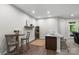 Cozy dining area with a mini bar that includes a sink, wine rack, and a door to outside at 3817 Arial Ln # 145, York, SC 29745