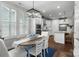 Open dining area with a wooden table and seating near bright, shuttered windows at 3817 Arial Ln # 145, York, SC 29745
