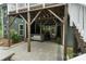 Covered hot tub located beneath the deck, offering a private and relaxing outdoor experience on the stone patio at 3817 Arial Ln # 145, York, SC 29745
