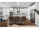 Stylish kitchen with stainless steel appliances and kitchen island with bar stool seating at 3817 Arial Ln # 145, York, SC 29745