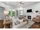 Bright living room featuring a fireplace, hardwood floors, and access to an outdoor patio at 3817 Arial Ln # 145, York, SC 29745