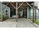Outdoor patio area with a hot tub, wooden pergola, and paved flooring for relaxation and entertainment at 3817 Arial Ln # 145, York, SC 29745