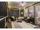 Screened-in porch with cozy seating, area rug, string lights and ceiling fan at 3817 Arial Ln # 145, York, SC 29745