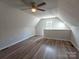 Large bonus room with hardwood floors, a ceiling fan, and natural light at 406 4Th St, Spencer, NC 28159