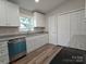 Bright kitchen featuring stainless steel appliances, white cabinets, and granite countertops at 406 4Th St, Spencer, NC 28159