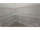 Spacious walk-in closet with ample shelving and storage space at 406 4Th St, Spencer, NC 28159