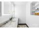 Contemporary bathroom featuring marble countertops, double sinks and modern lit mirrors at 4339 Shannamara Dr, Matthews, NC 28104