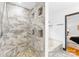 Elegant bathroom with stone shower, recessed niche and view of tub and bedroom at 4339 Shannamara Dr, Matthews, NC 28104