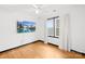 Bedroom featuring hardwood floors, ceiling fan, window with curtains and TV at 4339 Shannamara Dr, Matthews, NC 28104