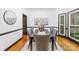 Formal dining room with a dark wood table, gray upholstered chairs, and elegant decor for Gathering gatherings at 4339 Shannamara Dr, Matthews, NC 28104