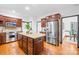 Spacious kitchen boasts stainless steel appliances, granite countertops, and a kitchen island at 4339 Shannamara Dr, Matthews, NC 28104