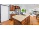 Kitchen island with granite countertops, lots of drawers, and stainless steel refrigerator at 4339 Shannamara Dr, Matthews, NC 28104