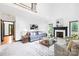 Spacious living room with cozy seating, fireplace, and large windows for ample natural light at 4339 Shannamara Dr, Matthews, NC 28104