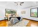 Bright main bedroom features a tray ceiling, a ceiling fan, and lots of natural light at 4339 Shannamara Dr, Matthews, NC 28104