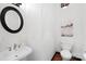 Bright powder room features modern fixtures and decor with white walls and elegant details at 4339 Shannamara Dr, Matthews, NC 28104