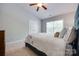 This bedroom features carpet floors, a ceiling fan and double door closet at 461 Hurston Cir # 51, Charlotte, NC 28208