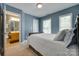 Blue bedroom featuring views to an en suite bathroom at 461 Hurston Cir # 51, Charlotte, NC 28208