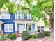 Charming townhome with a colorful exterior, front porch, and landscaped yard at 461 Hurston Cir # 51, Charlotte, NC 28208