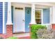Inviting front entrance with brick accents, columns, and a 'Welcome' mat at 461 Hurston Cir # 51, Charlotte, NC 28208